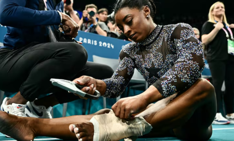 Simone Biles shakes off a calf injury to dominate during Olympic gymnastics qualifying