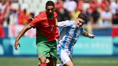 Fans storm pitch and throw bottles as Argentina v Morocco